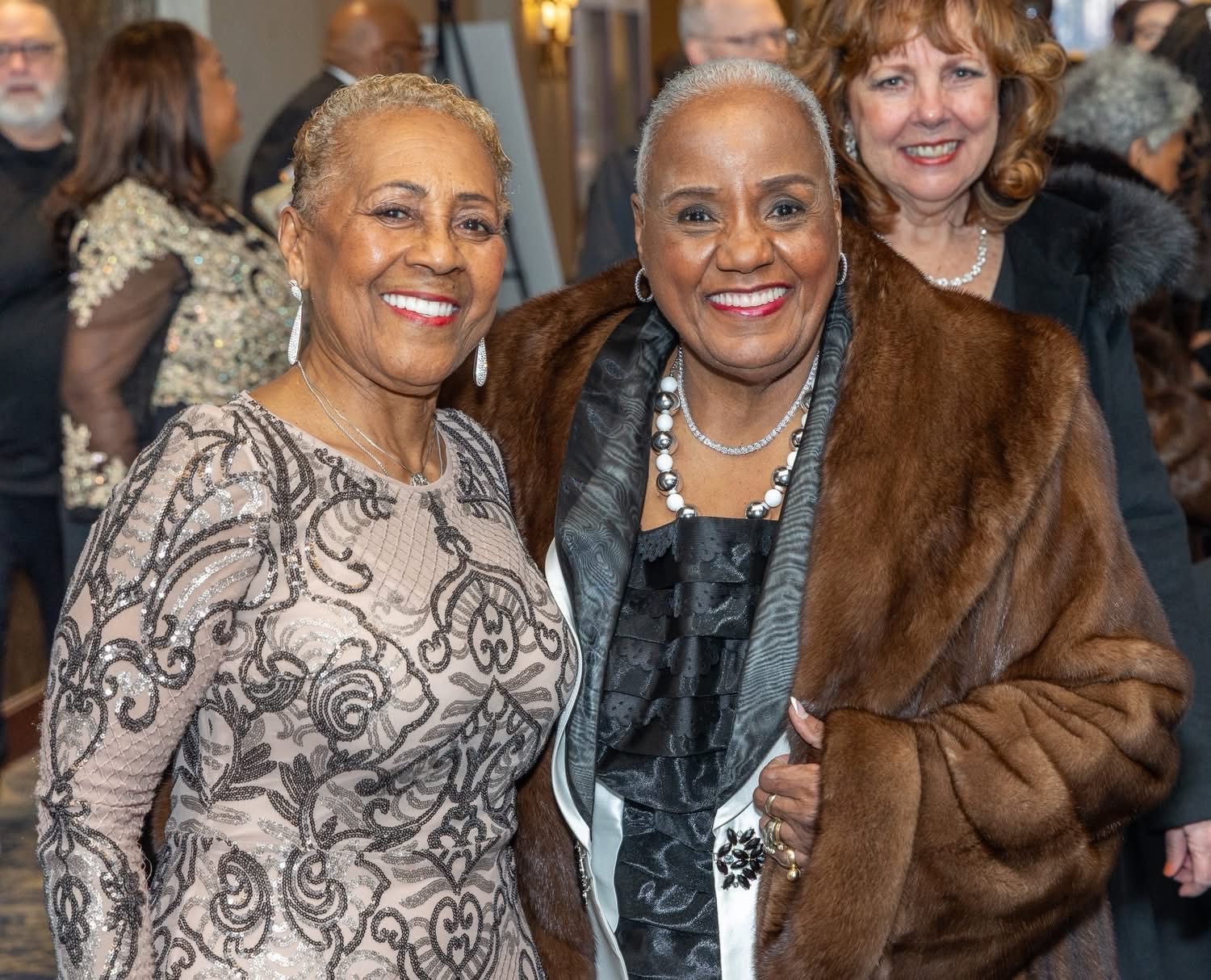 Golden Opportunity Club members smiling together at an event